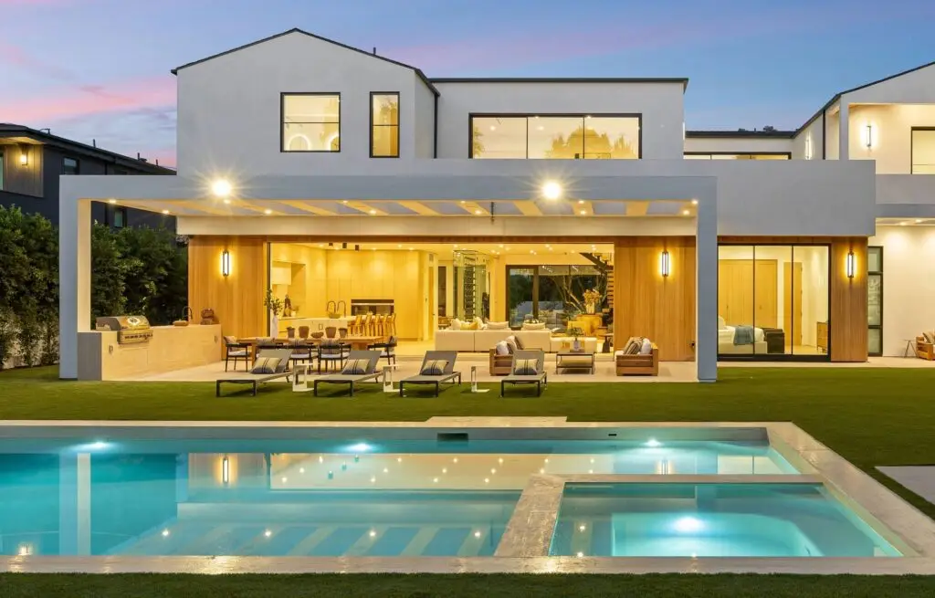 Open-concept modern home with pool and outdoor living space.