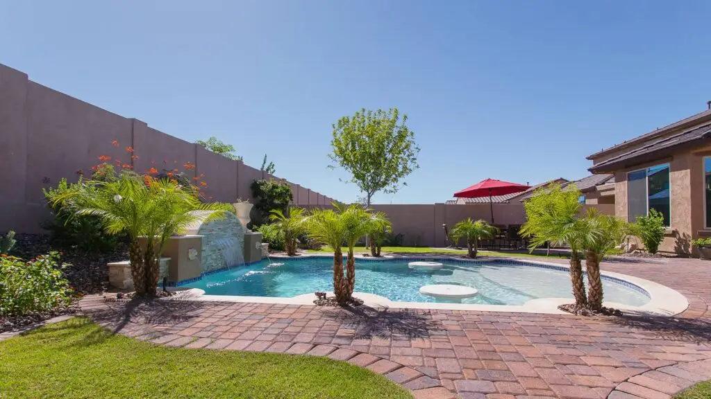 Luxury backyard pool representing professional pool care.